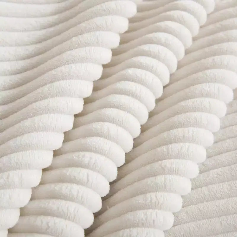 Canapé d'angle confortable en velours côtelé avec oreillers et accoudoirs ronds, canapé-lit moderne profond avec pouf de rangement