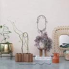 Miroir mural tissé en rotin à cadre pétale Storied Home, naturel