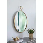 Miroir mural rond de 26 x 32 pouces avec cadre en métal doré