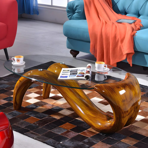 Table basse ovale moderne et abstraite avec plateau en verre et base en métal