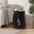 Table d'appoint évidée, texture aspect bois, coloris noir