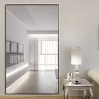 Miroir mural décoratif rectangulaire Dovelina à cadre métallique moderne